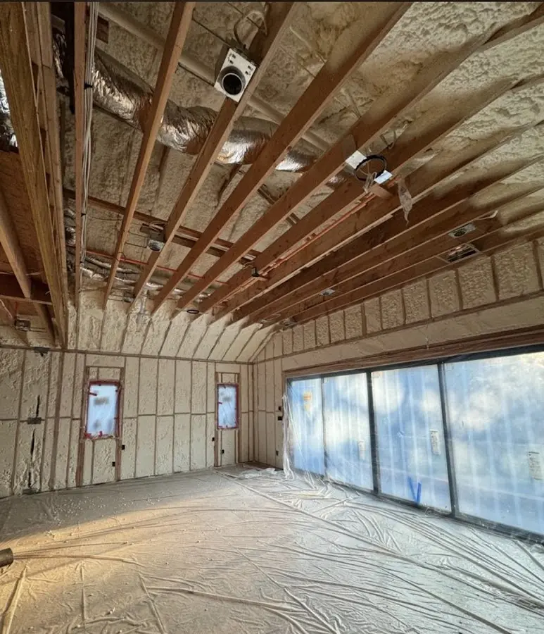 Interior walls and ceiling insulated with spray foam during new construction in Oceanport